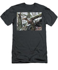 Snow Falling in Ancent Woodland with Animal Shaped Tree Trunk Philip Openshaw T-Shirt