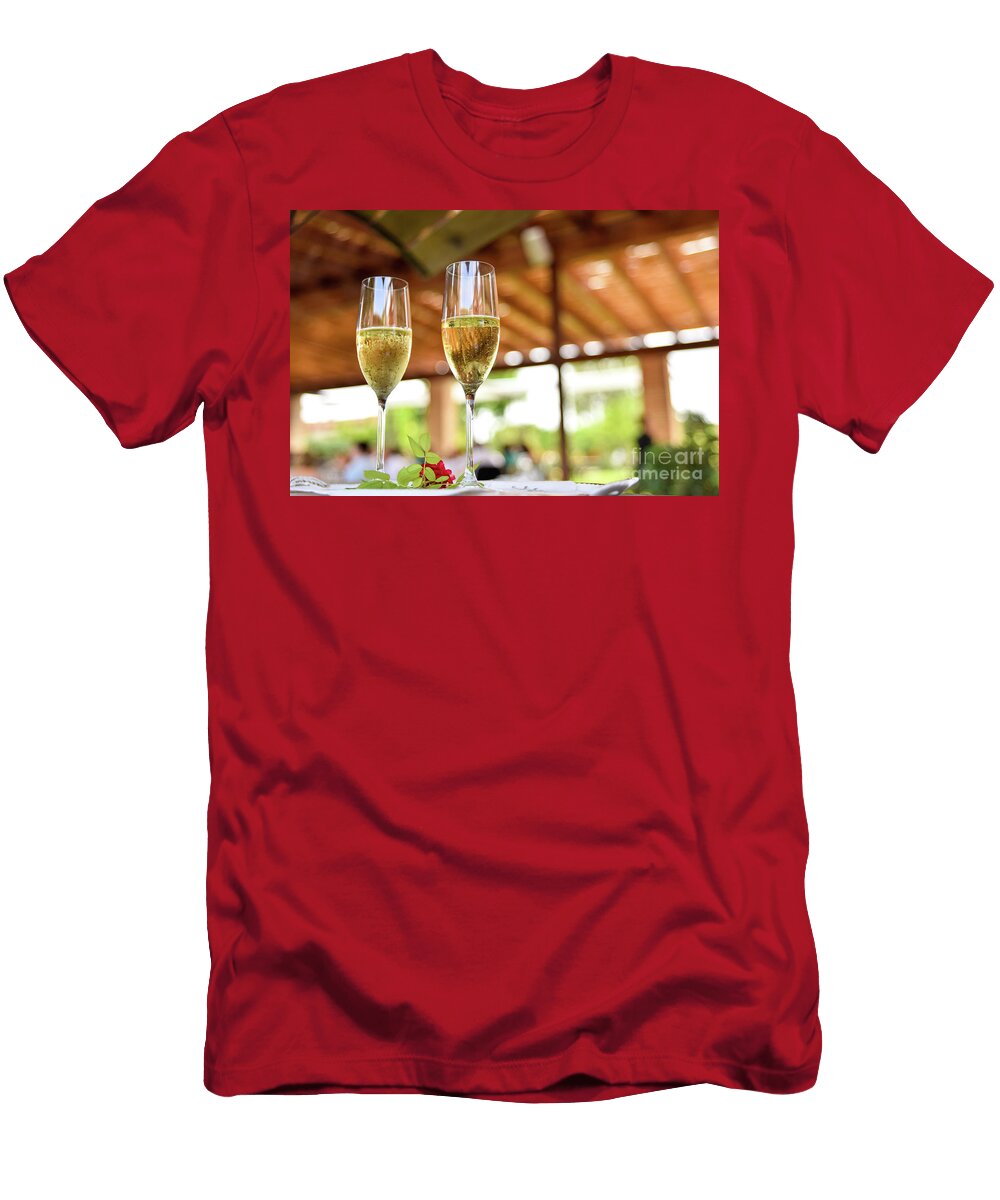 Two Glasses of Bubbly Champagne with Unfocused Background of a Celebration Joaquin Corbalan T-Shirt